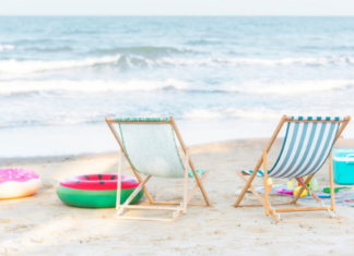 Practice the Pause: two beach chairs face the ocean waves with beach toys scattered around.