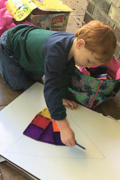 preschooler activities: a boy playing with magnetic tiles