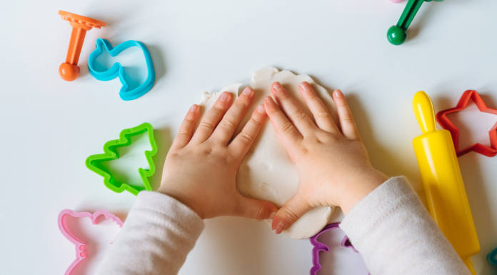 preschooler activities: a child plays with playdough and shapes