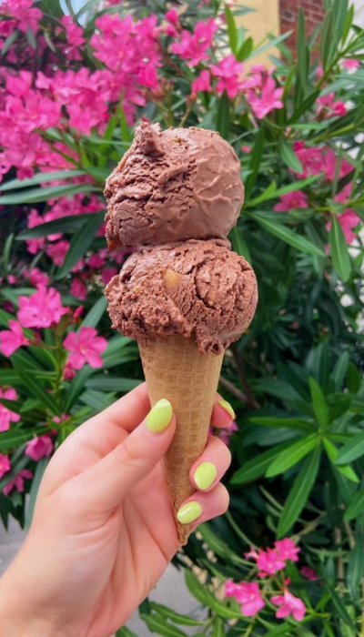 cold treats: two scoops of chocolate ice cream in a waffle cone.