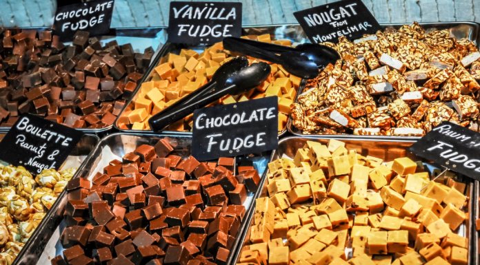 Different flavors of fudge on trays.