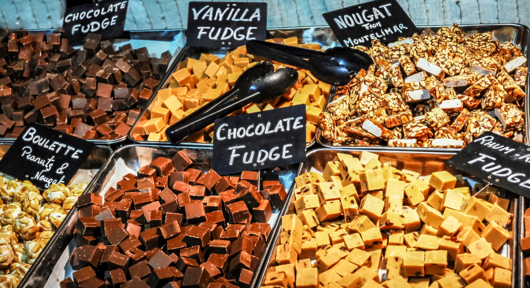 Different flavors of fudge on trays.