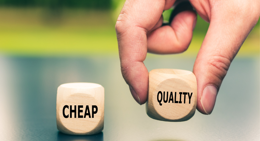 Buy More Expensive item: two die are on a table, one says CHEAP and the other says QUALITY. A hand is picking up the dice that says QUALITY.