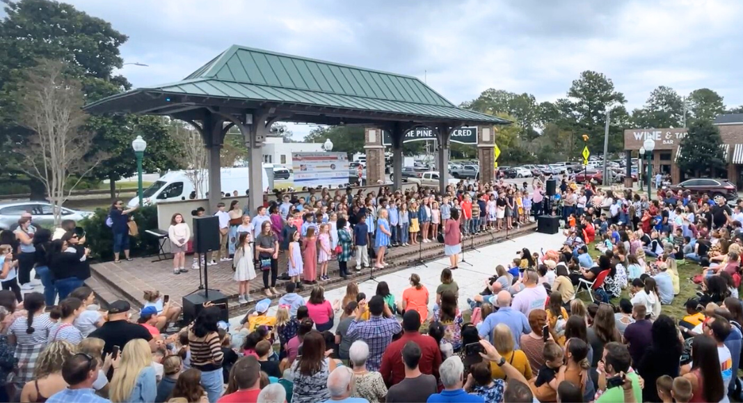 Students perform on the stage to a crowd of people at the Summerville Italian Feast.