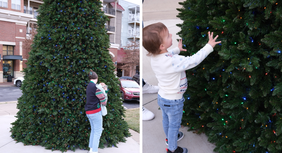 Left: a mom holds her baby and looks at a giant christmas tree outside. Right: a toddler touches a giant Christmas tree outside.