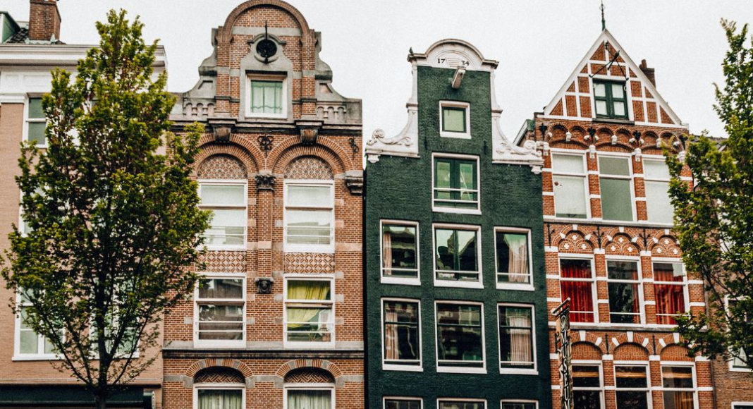 holiday traditions from around the world: red and green brick buildings with different shaped architecture