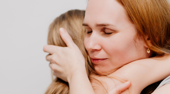 a mother hugs her daughter after receiving disappointing news