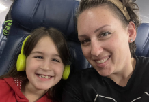 Solo trips with kids: a mom and her child sitting in airplane seats.