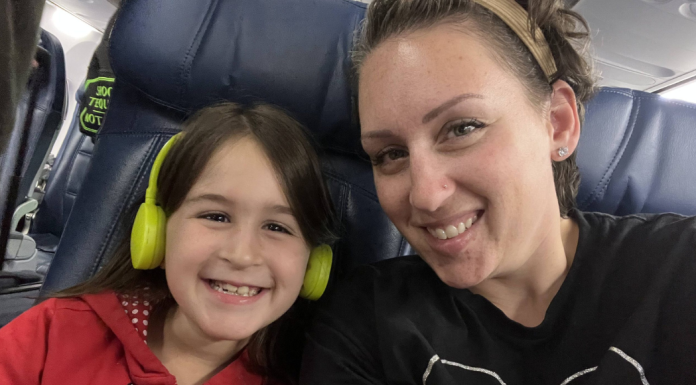 Solo trips with kids: a mom and her child sitting in airplane seats.