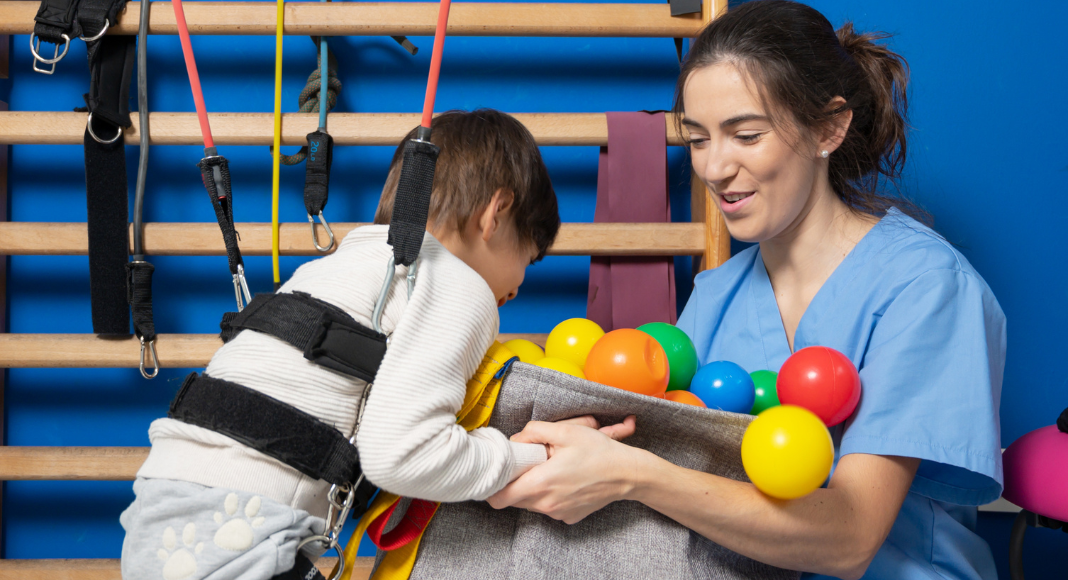 Cerebral palsy: a young boy at physical therapy.