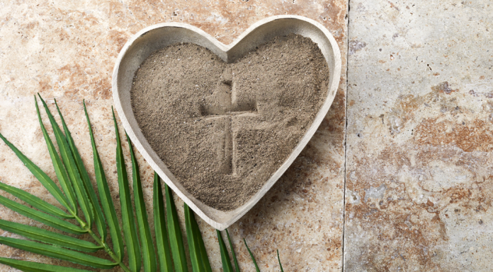 Ash Wednesday: a heart shaped dish with ashes and a cross drawn in them.