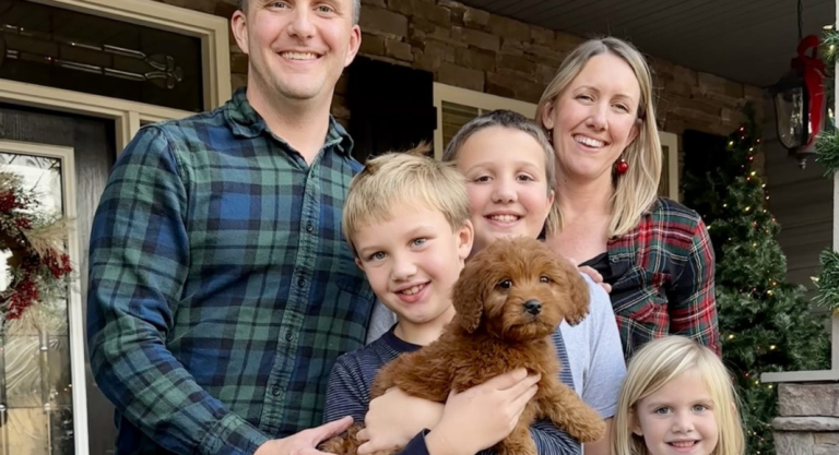 Katie Guffey with her husband, three children, and puppy.