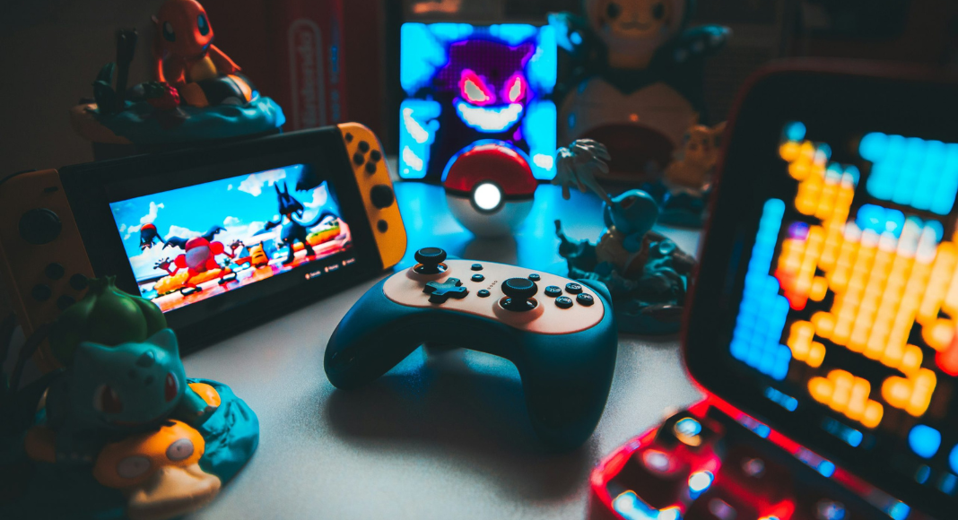 National Pokémon Day: Video gaming systems, controllers, and pokémon character toys.