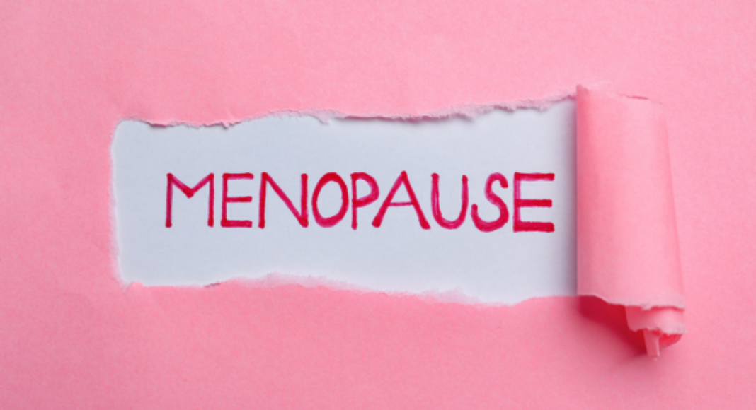 The word menopause with a pink background.