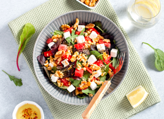 summer salads: a salad in a bowl surrounded by various ingredients.