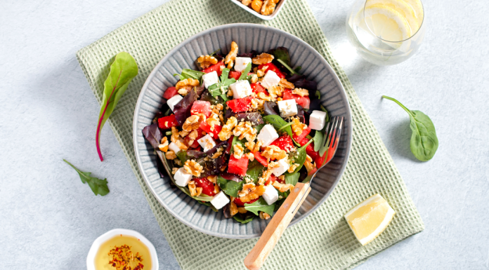 summer salads: a salad in a bowl surrounded by various ingredients.