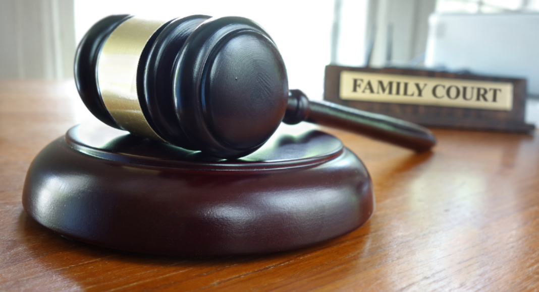 Types of Divorce: a gavel lays on a table with the sign "Family Court" behind it.