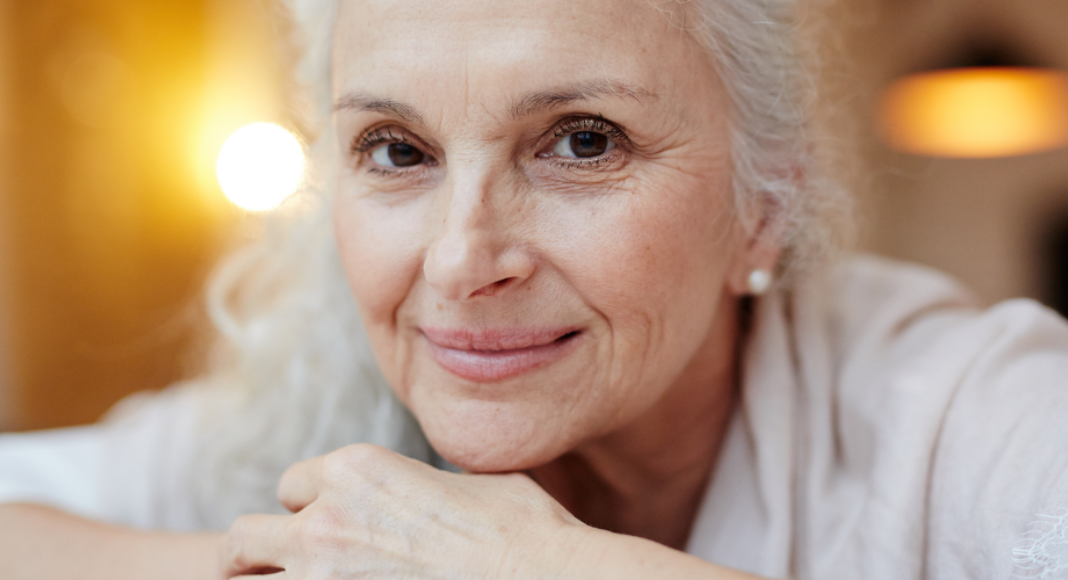Love aging: an older woman smiles.
