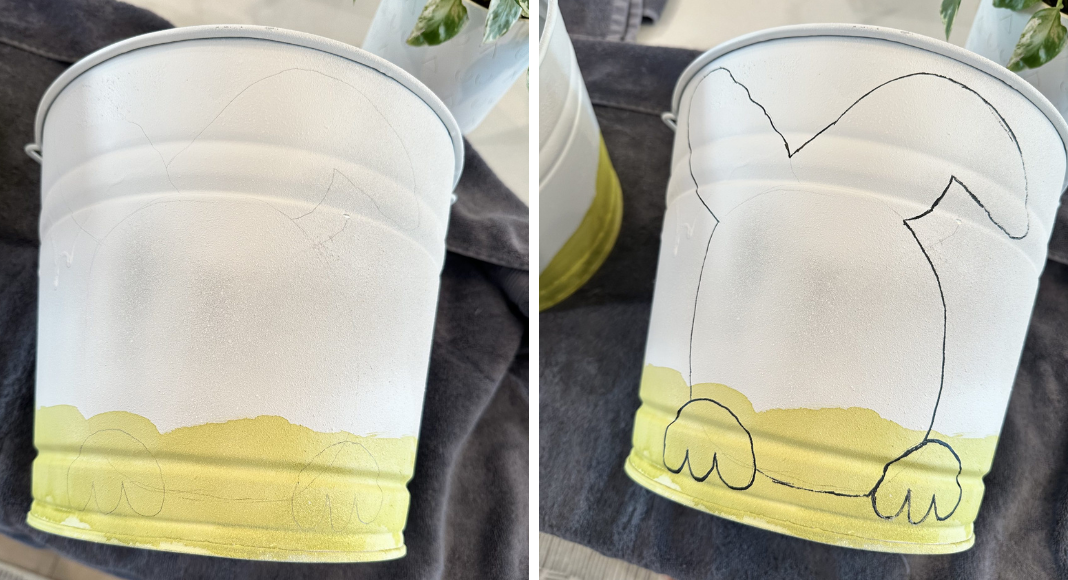 Easter baskets: Two buckets with white primer, green grass painted on the bottom sections, and outlines of bunnies.