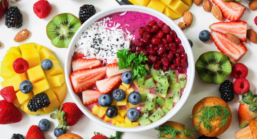 Stroke Awareness Month: a bowl of fruit surrounded by other healthy foods.